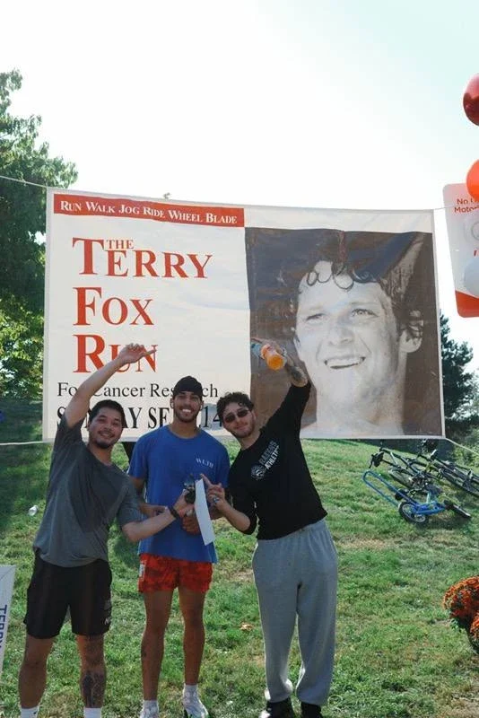 WLTH members at the Terry Fox Run in Port Credit, one wearing the Toy Drive Tee